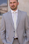 Man wearing dusty sage floral tie