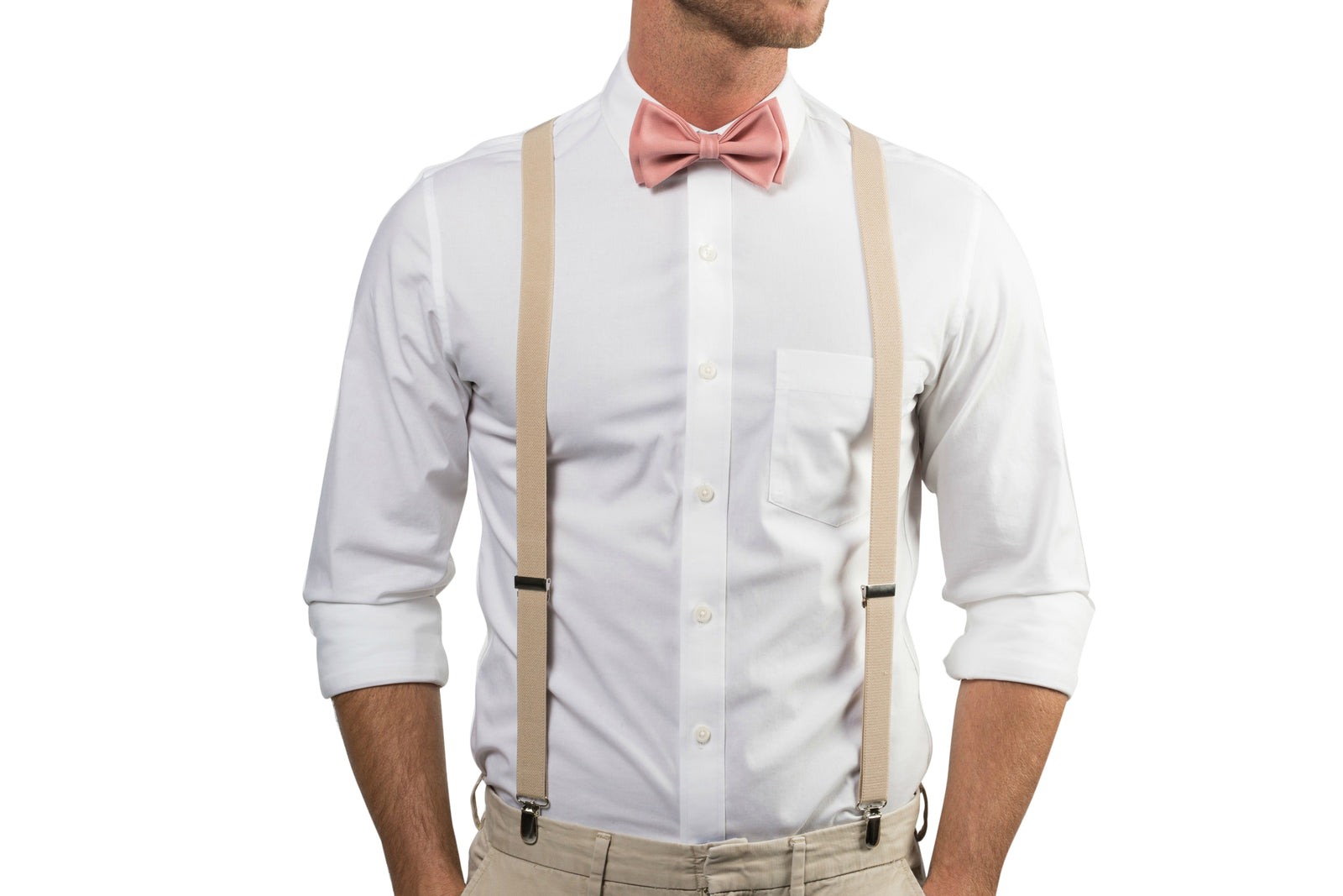 Torso of man wearing beige suspenders and dusty rose bow tie