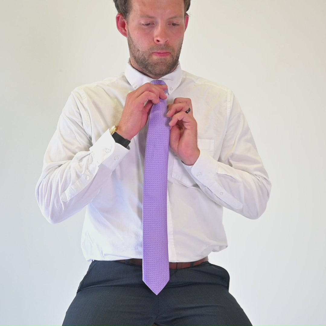 Man featuring purple tie