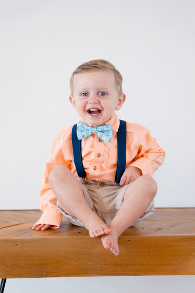 Toddler boy wearing Easter bow tie and suspenders